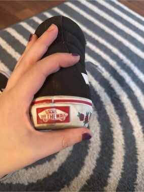 Vans Black Slip-On Sneakers with Rose Detail
